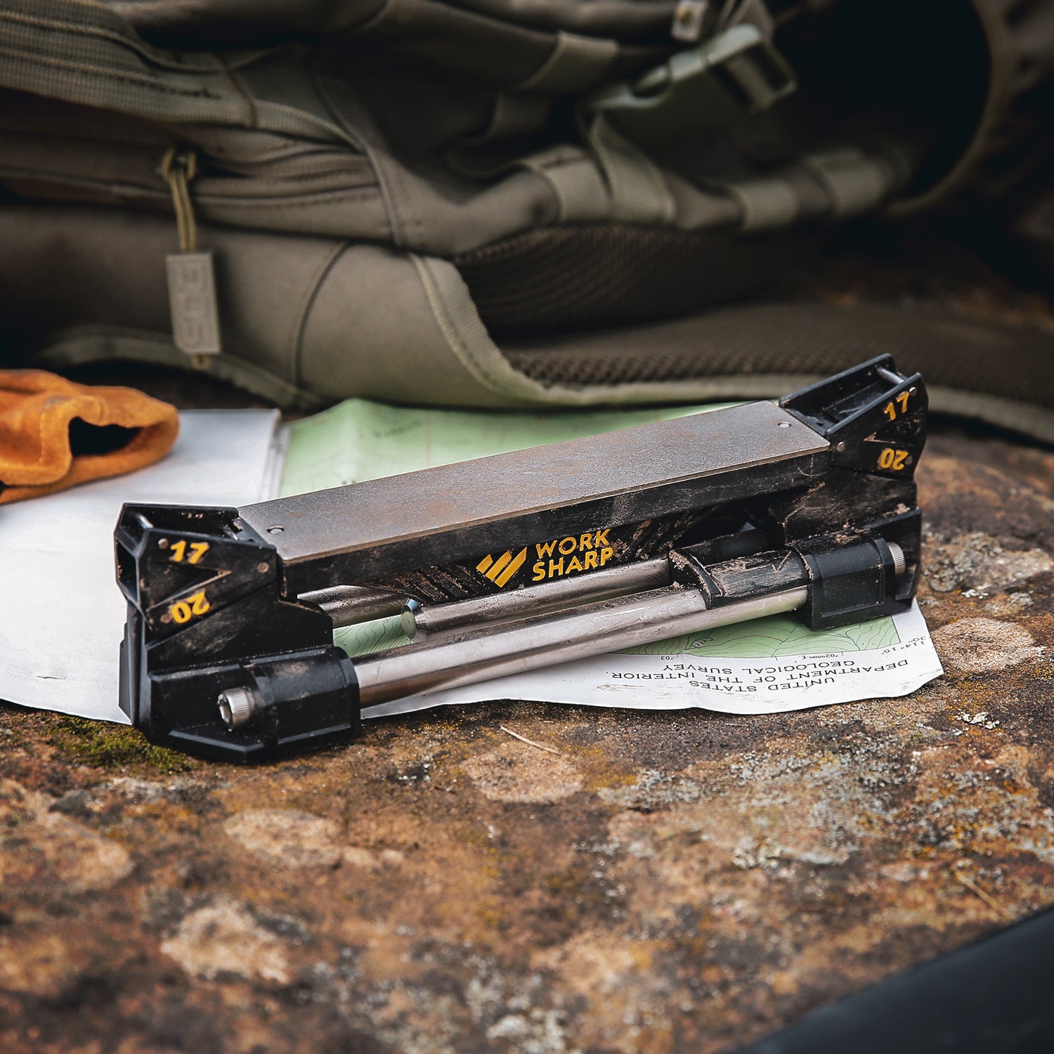 Work Sharp Guided Sharping System on top of a map with hunting essentials