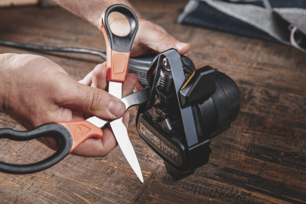 sharpen scissors on sharpener guide angle